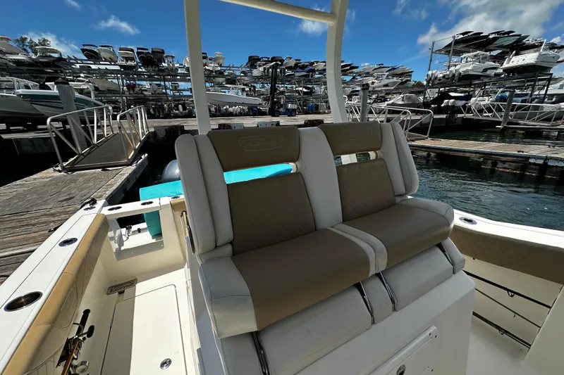 Slide: The Image of 2019 Pioneer 266 Pelagic boat interior at marina with stacked boats in background. - 29