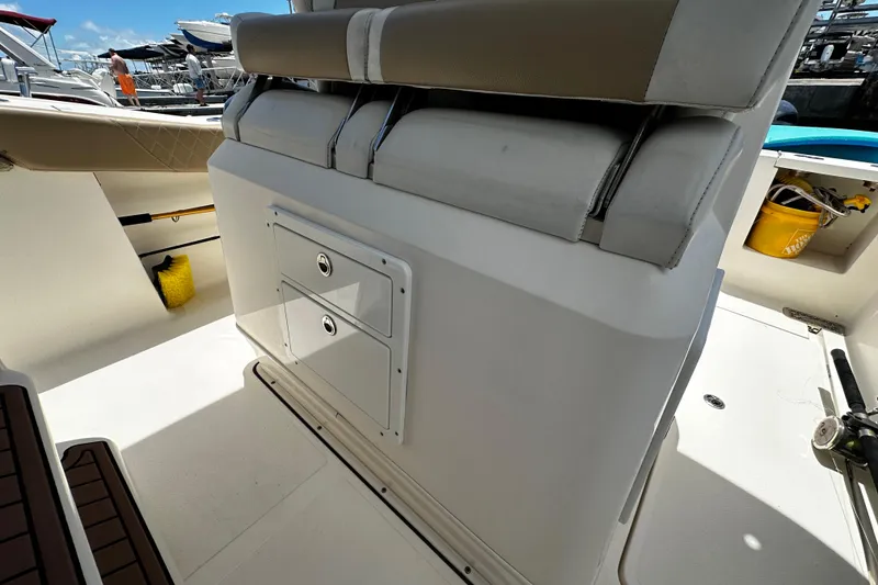 Slide: The Image of 2019 Pioneer 266 Pelagic boat interior with storage compartments and seating. - 31