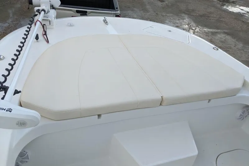 Slide: The Image of Front deck of 2026 Tideline 235 Hybrid boat with cushioned seating. - 14