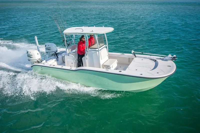 Slide: The Image of 2026 Tideline 235 Hybrid boat cruising on clear blue water. - 4