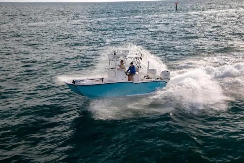 Slide: The Image of 2026 Tideline 235 Hybrid boat cruising on open water, showcasing speed and performance. - 5
