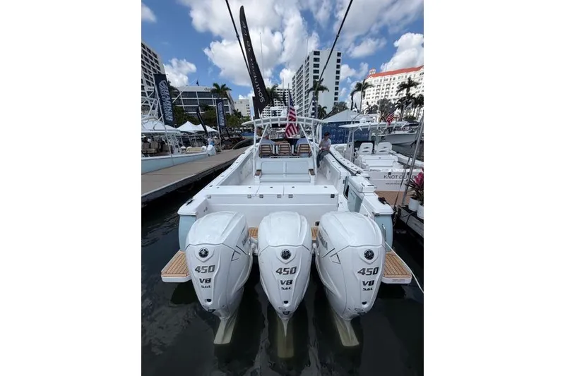 Slide: The Image of 2026 Southport 38 FE boat with triple 450 V8 engines at the dock. - 2