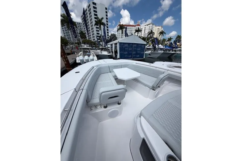 Slide: The Image of 2026 Southport 38 FE boat with luxurious seating area at the marina. - 9