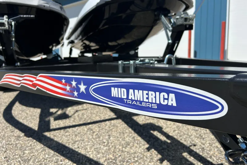 Slide: The Image of Trailer with "Mid America Trailers" logo, holding a 2016 Yamaha FX Cruiser SHO. - 13