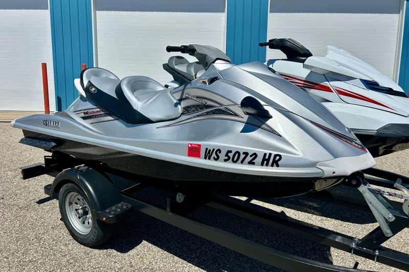 Slide: The Image of 2016 Yamaha FX Cruiser SHO jet ski on trailer, parked outdoors. - 2
