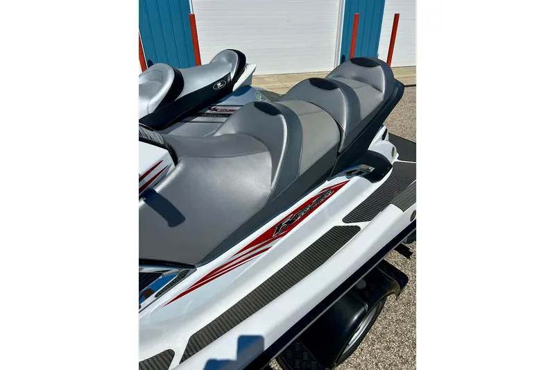 Slide: The Image of 2016 Yamaha FX Cruiser SHO jet ski with sleek gray seating and red accents. - 21