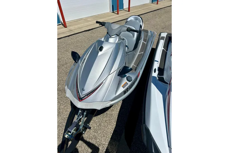 Slide: The Image of 2016 Yamaha FX Cruiser SHO jet ski in silver, parked on pavement. - 23
