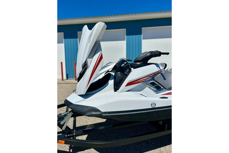 Slide: The Image of 2016 Yamaha FX Cruiser SHO jet ski with sleek design and red accents, parked outdoors. - 25
