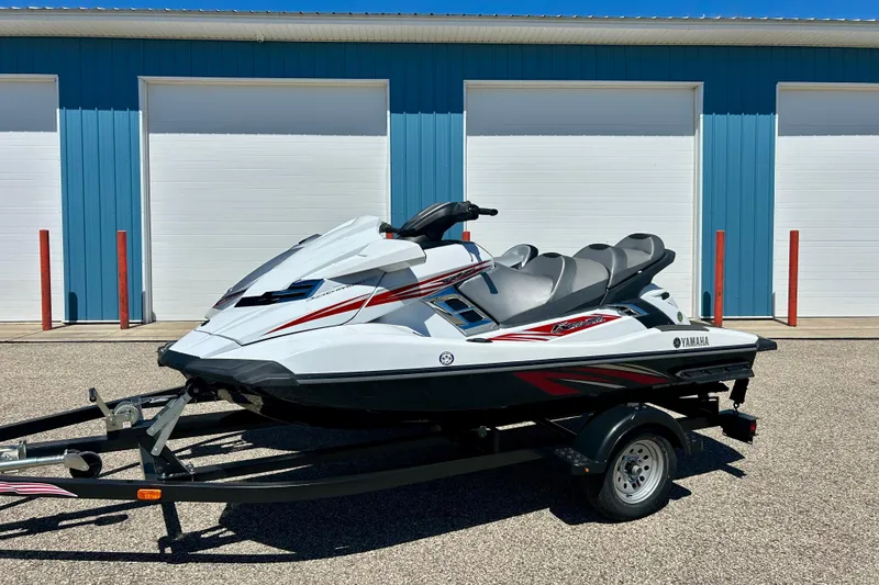 Slide: The Image of 2016 Yamaha FX Cruiser SHO jet ski on trailer, parked in front of blue garage doors. - 3