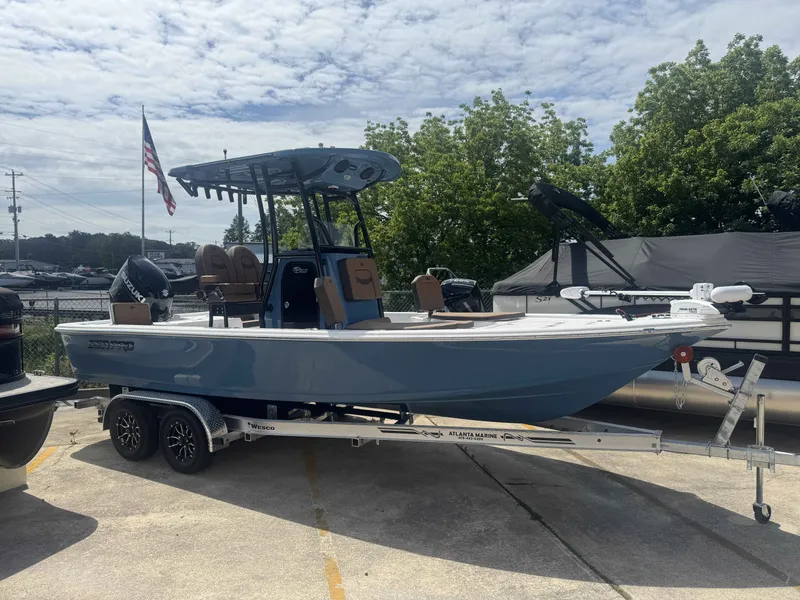 Slide: The Image of 2026 Sea Pro 230 DLX boat on trailer outdoors. - 10
