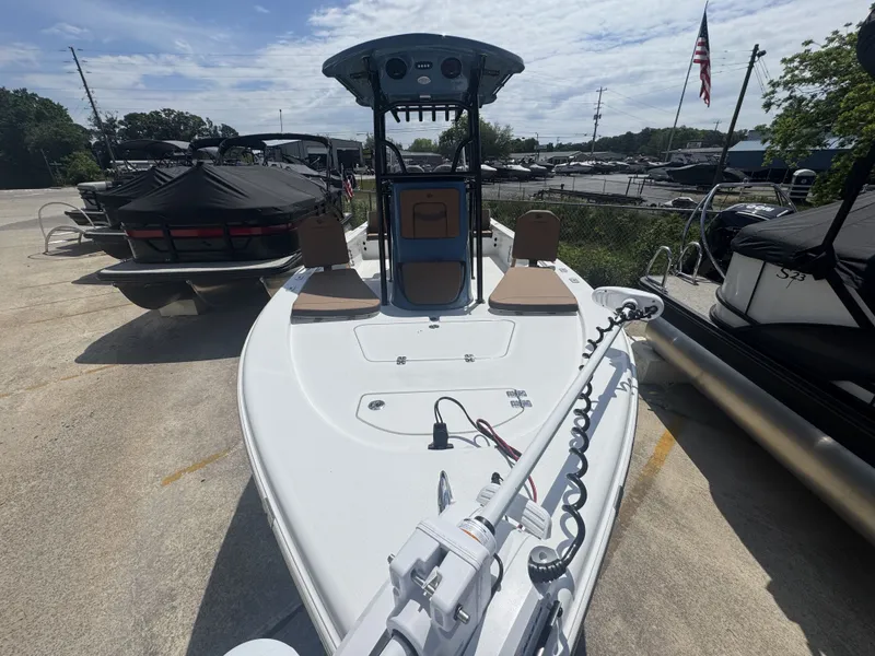 Slide: The Image of 2026 Sea Pro 230 DLX boat parked outdoors under sunny skies. - 11