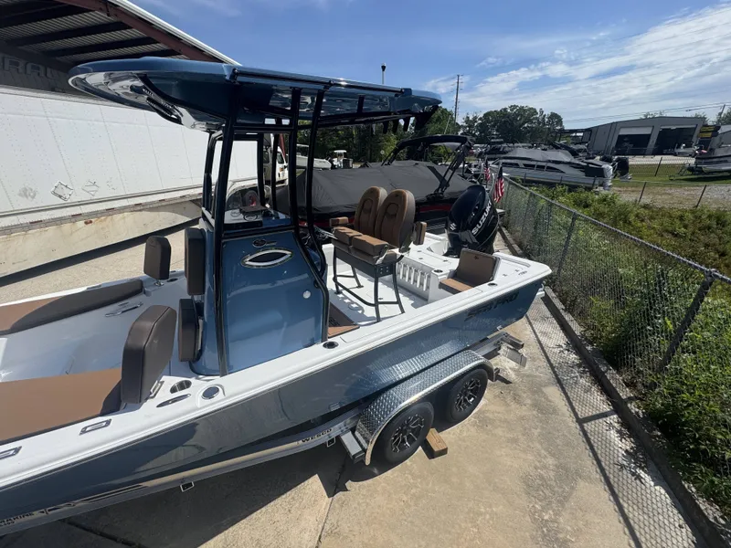 Slide: The Image of 2026 Sea Pro 230 DLX boat on trailer outdoors. - 12