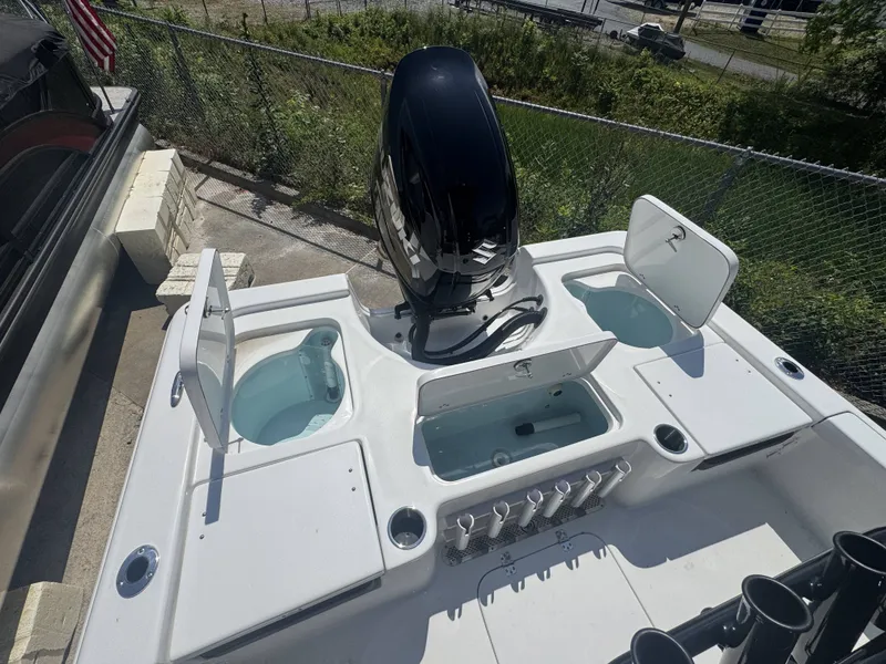 Slide: The Image of 2026 Sea Pro 230 DLX boat with engine and storage compartments. - 15