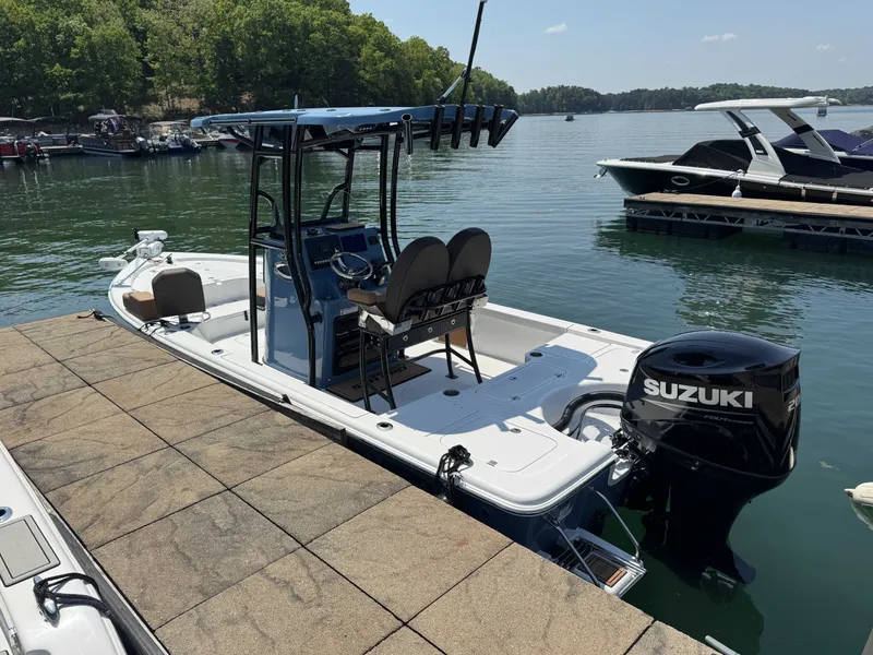 Slide: The Image of 2026 Sea Pro 230 DLX boat docked with Suzuki engine. - 5