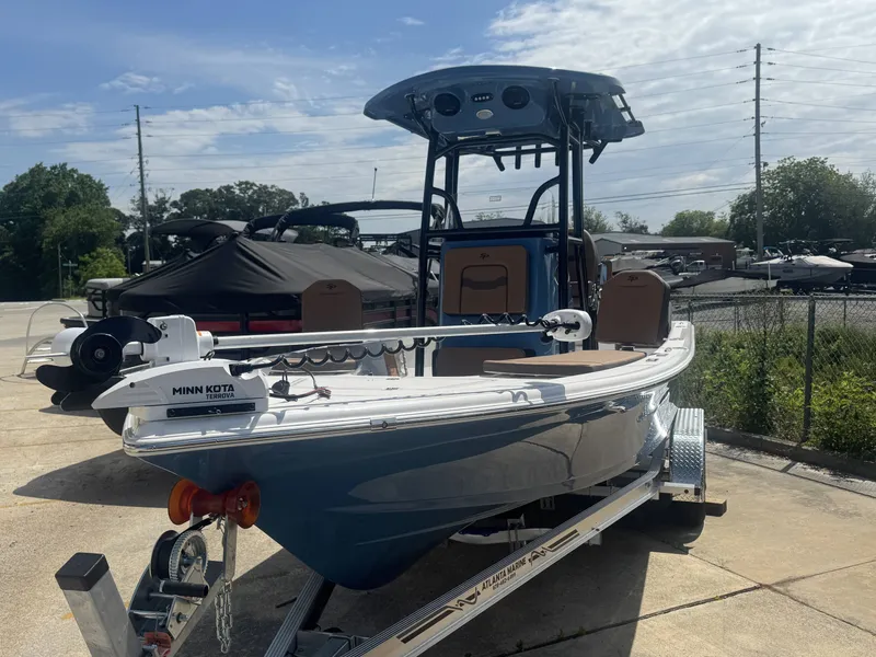 Slide: The Image of 2026 Sea Pro 230 DLX boat parked on trailer outdoors. - 8