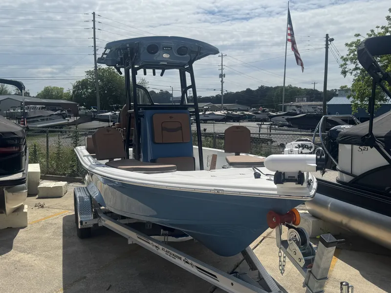 Slide: The Image of 2026 Sea Pro 230 DLX boat on trailer outdoors. - 9