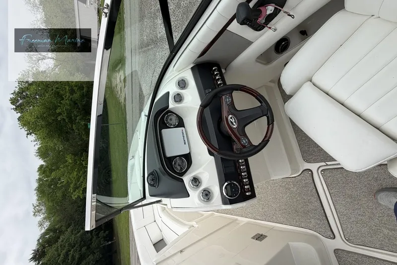Slide: The Image of Interior view of 2008 Sea Ray 270 SLX boat cockpit with steering wheel and controls. - 15