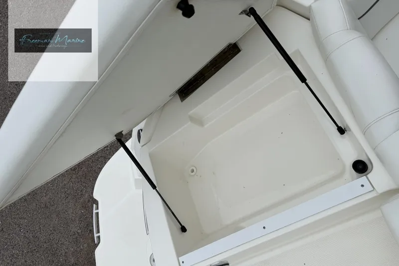 Slide: The Image of Open storage compartment on a 2008 Sea Ray 270 SLX boat, showcasing interior space. - 16