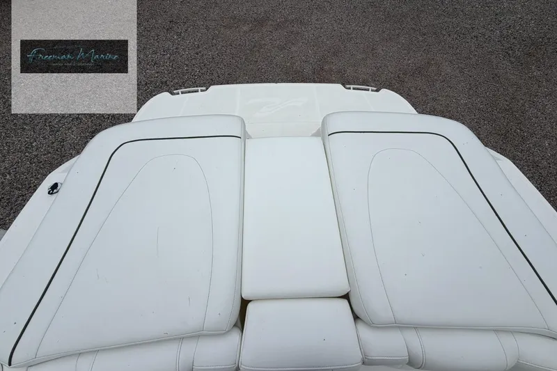 Slide: The Image of 2008 Sea Ray 270 SLX boat with white cushioned seating, viewed from above. - 19
