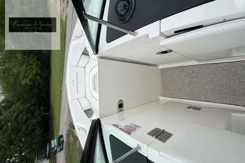 Slide: The Image of 2008 Sea Ray 270 SLX boat interior with white seating and carpeted flooring. - 21
