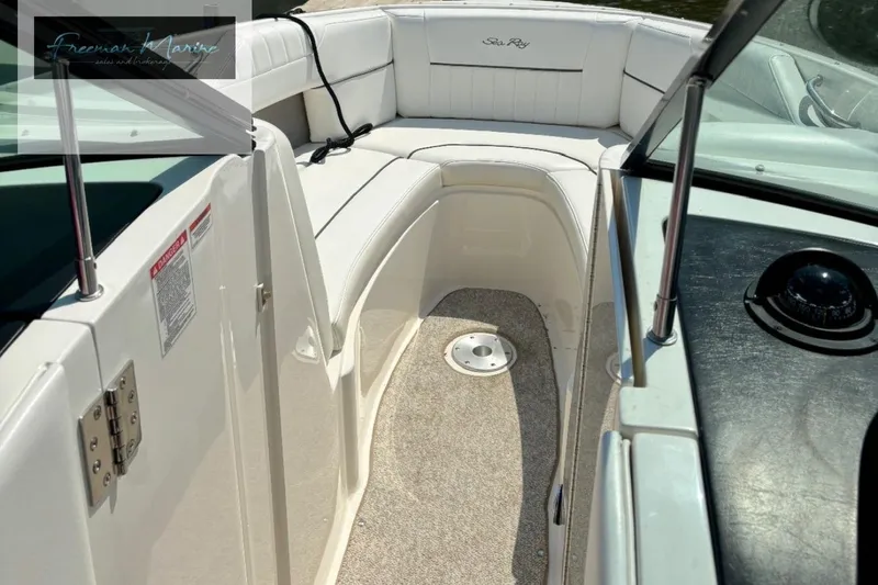 Slide: The Image of 2008 Sea Ray 270 SLX boat interior with white seating and dashboard view. - 22