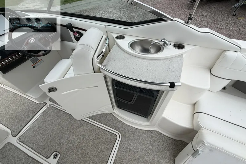 Slide: The Image of 2008 Sea Ray 270 SLX boat interior with sink, seating, and storage. - 23