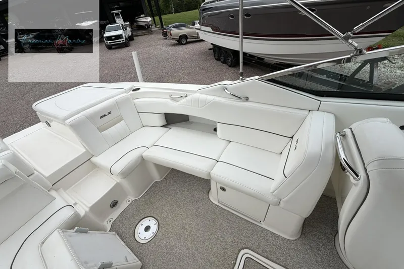 Slide: The Image of 2008 Sea Ray 270 SLX boat interior with white seating and carpeted floor. - 26