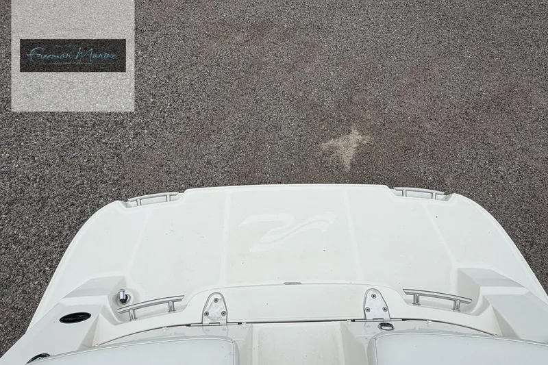 Slide: The Image of 2008 Sea Ray 270 SLX boat deck on textured surface. - 28