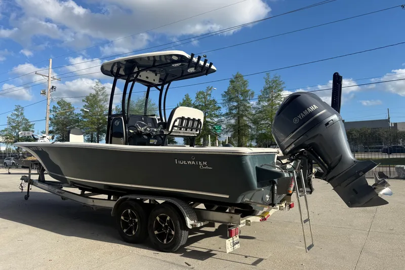 Slide: The Image of 2021 Tidewater 2500 Carolina Bay boat on trailer with Yamaha outboard motor. - 2