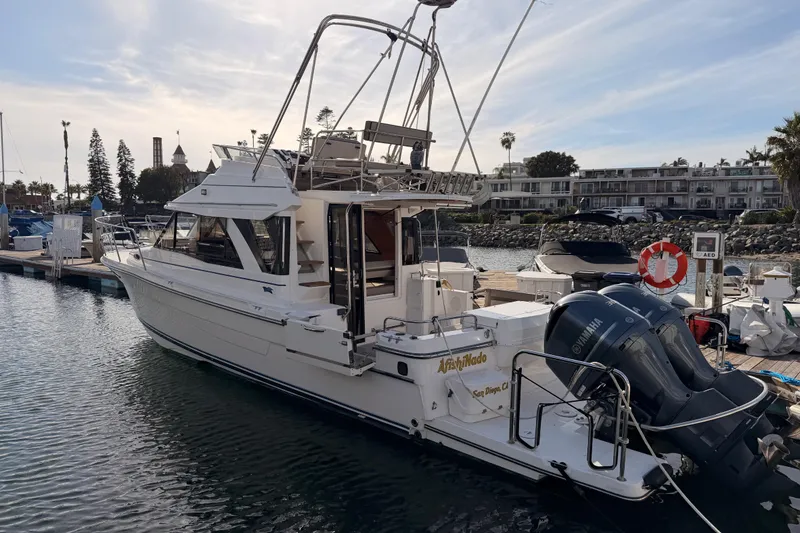 The Image of 2021 Cutwater C-32 CB yacht docked at sunset harbor. - 0