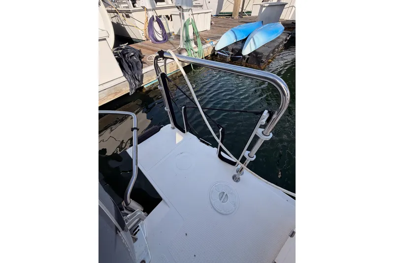 Slide: The Image of 2021 Cutwater C-32 CB boat docked with dual 300 horsepower engines. - 14