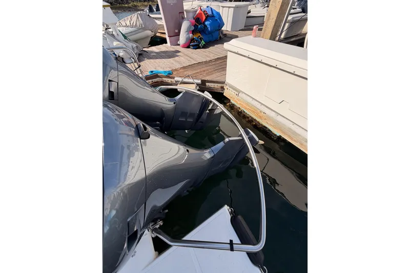 Slide: The Image of 2021 Cutwater C-32 CB boat docked, showcasing spacious deck and modern design. - 15