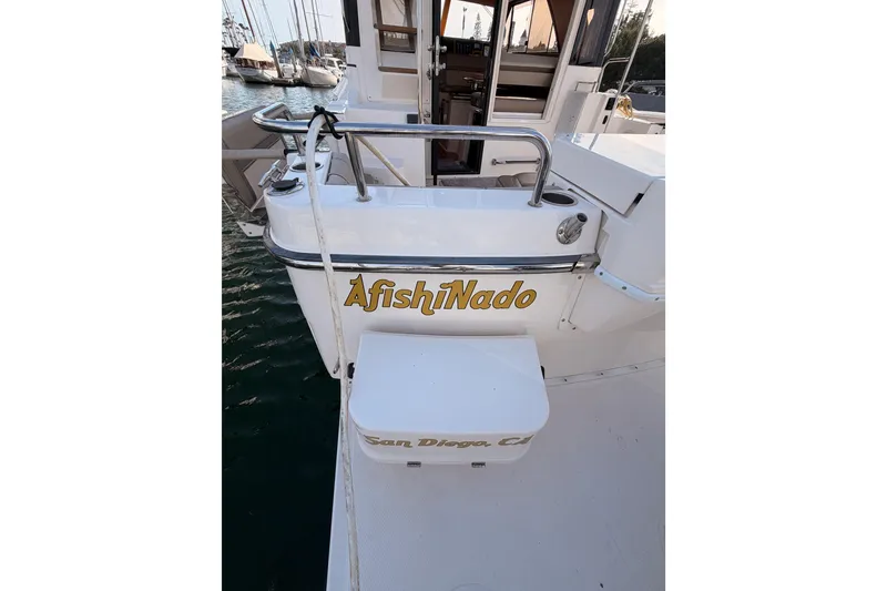 Slide: The Image of 2021 Cutwater C-32 CB boat interior with seating, docked at marina. - 16