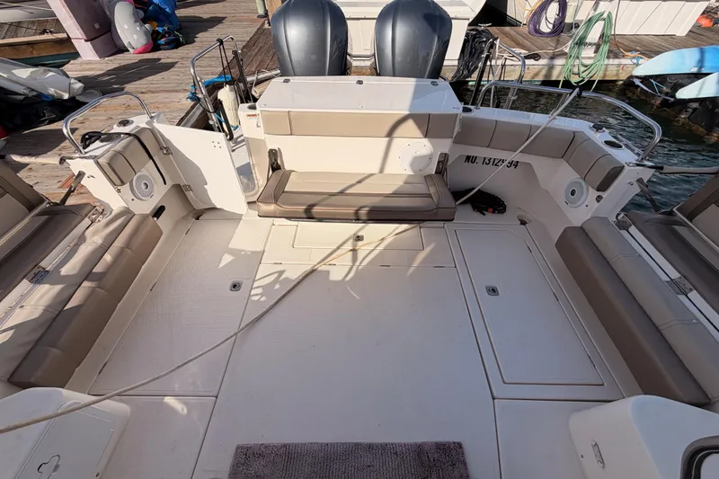 Slide: The Image of 2021 Cutwater C-32 CB yacht docked at marina, showcasing sleek design and open deck. - 20