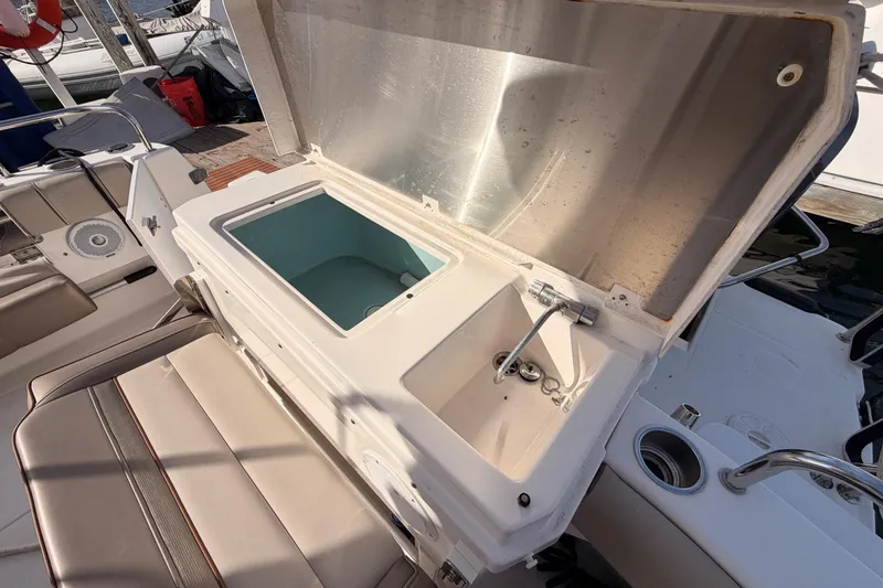 Slide: The Image of 2021 Cutwater C-32 CB boat interior with seating, docked at marina. - 21