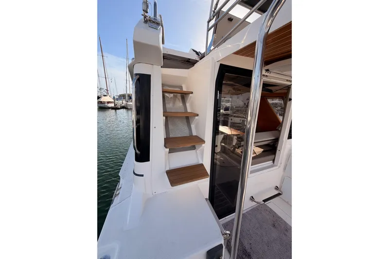 Slide: The Image of 2021 Cutwater C-32 CB boat docked, showcasing bow deck and railing. - 29