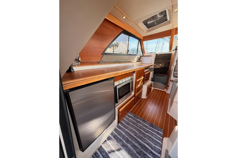 Slide: The Image of 2021 Cutwater C-32 CB boat with solar panel docked at marina. - 36