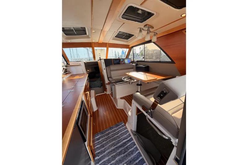 Slide: The Image of Open storage compartment on 2021 Cutwater C-32 CB boat deck. - 37