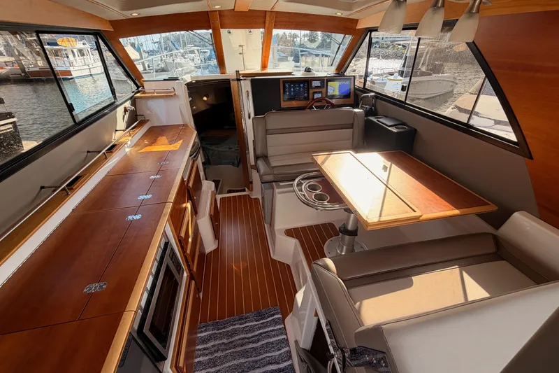 Slide: The Image of Interior view of 2021 Cutwater C-32 CB boat, showcasing cabin and helm area. - 38