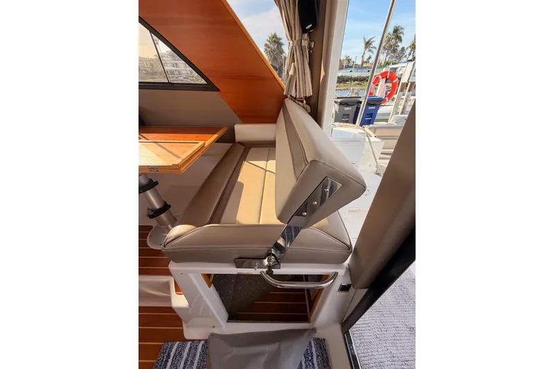 Slide: The Image of Interior of 2021 Cutwater C-32 CB boat with modern kitchen and wood accents. - 39