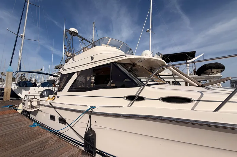 Slide: The Image of 2021 Cutwater C-32 CB yacht docked at marina under clear sky. - 4