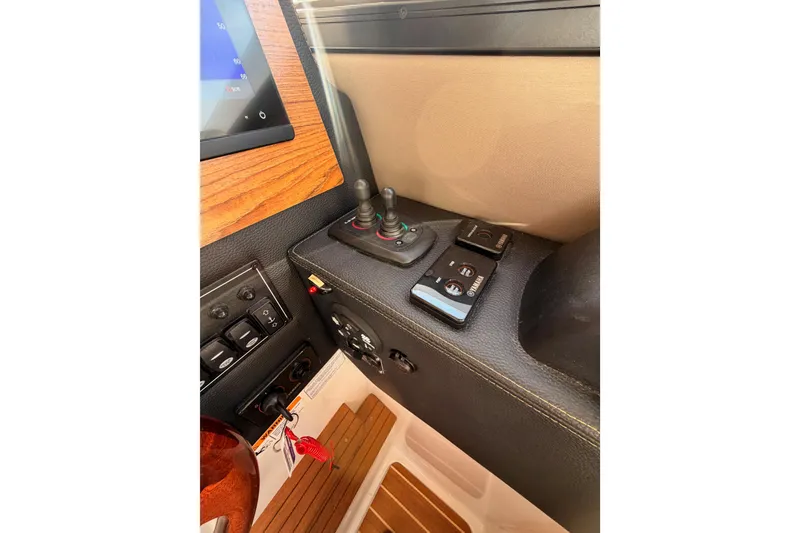 Slide: The Image of 2021 Cutwater C-32 CB helm with advanced navigation displays and controls. - 54