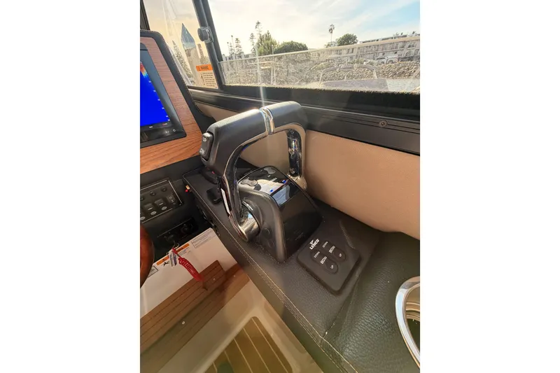 Slide: The Image of Control panel of a 2021 Cutwater C-32 CB boat with Garmin devices. - 55