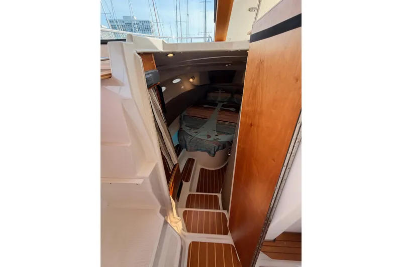 Slide: The Image of Helm of 2021 Cutwater C-32 CB with advanced Garmin navigation displays and controls. - 56