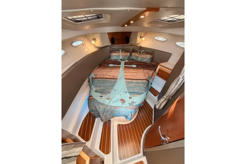 Slide: The Image of 2021 Cutwater C-32 CB helm controls with throttle and navigation display. - 58