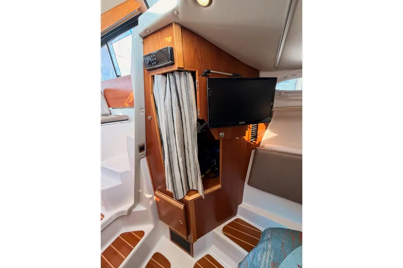 Slide: The Image of Interior cabin view of 2021 Cutwater C-32 CB boat with wooden flooring. - 59