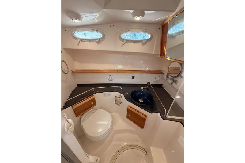 Slide: The Image of Interior of 2021 Cutwater C-32 CB boat with wood finishes and modern amenities. - 64