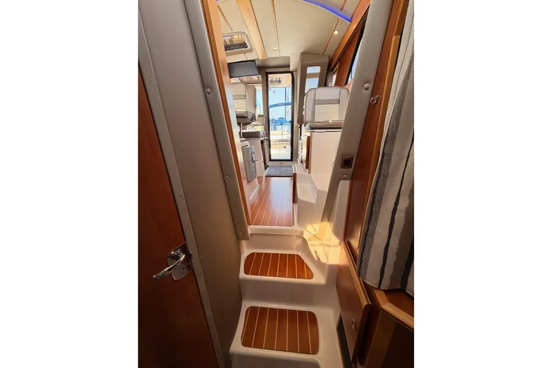 Slide: The Image of Shower area in 2021 Cutwater C-32 CB boat, featuring modern fixtures and a sleek design. - 69