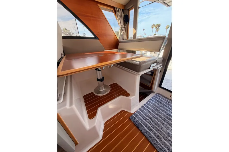 Slide: The Image of Interior view of 2021 Cutwater C-32 CB boat, featuring wooden flooring and modern design. - 72