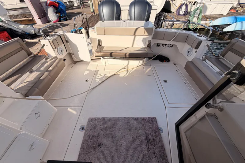 Slide: The Image of 2021 Cutwater C-32 CB boat deck with seating and storage compartments. - 79